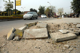 A damaged central verge remains unrepaired