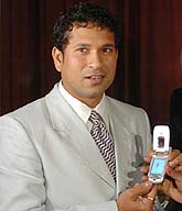 Sachin Tendulkar displays a mobile phone launched by G-Hanz GmbH in Mumbai on Monday.