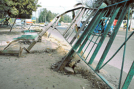 broken railing on a road divider remains unrepaired near the YPS roundabout