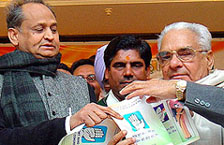 AICC General Secretary Ashok Gehlot and Haryana Congress President Bhajan Lal release the party manifesto for the Haryana Assembly elections in Chandigarh on Monday