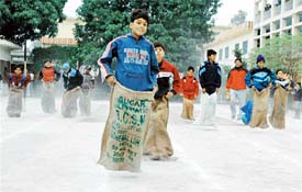 Students take part in the sack race during the annual athletic meet of Sanatan Vidya Mandir Senior Secondary School, Civil Lines, Ludhiana, on Monday