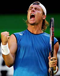 Australias Lleyton Hewitt celebrates his victory over Spains Rafael Nadal at the Australian Open in Melbourne on Monday