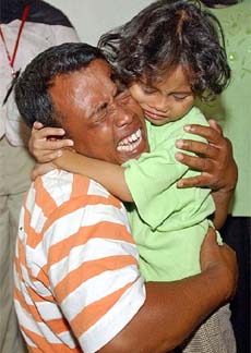 Mustafa Kamal bursts into tears as he is reunited with his daughter, Rina Augustina, after being separated for nearly a month