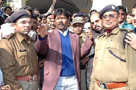Jharkhand Janadhikar Party president Bandhu Tirkey (centre) being arrested after he filed his nomination papers from the Mandar constituency of Ranchi on Tuesday.