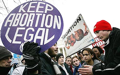 Pro-choice activist Luqman Clark of Arlington argues with a group of anti-abortion protestors outside the US supreme Court in Washington on Monday