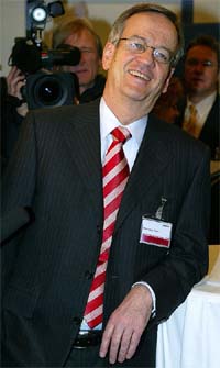 Heinrich von Pierer, outgoing Chief Executive of German engineering conglomerate Siemens AG, poses for the media before the start of the annual shareholder meeting in Munich