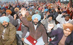 Members of the Punjab Subordinate Services Federation protest at Matka Chowk in Sector 17, Chandigarh