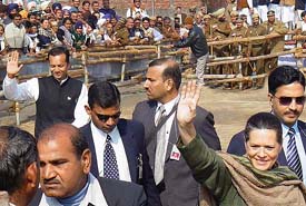 Congress President Sonia Gandhi waves to the crowd after addressing an election rally at Pehowa in Kurukshetra district on Friday. 