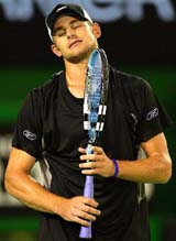 Andy Roddick reacts after losing a point during his semifinal against Lleyton Hewitt at the Australian Open in Melbourne