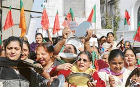 Members of the BJP Mahila Morcha protest against power shortage at Clock Tower in Ludhiana on Saturday