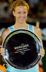 Lindsay Davenport holds the runner-up trophy after losing the womens singles final to Serena Williams at the Australian Open in Melbourne on Saturday