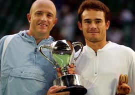 Kevin Ullyett and Wayne Black of Zimbabwe hold the trophy after winning the mens doubles final against Bob Bryan and Mike Bryan of the USA at the Australian Open