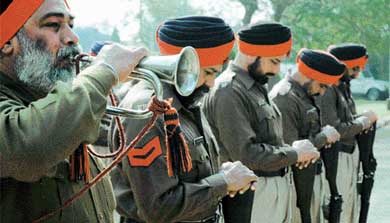 A police contingent pays homage to the Father of Nation, Mahatma Gandhi, at a function organised at Mini Secretariat in Ludhiana on Sunday
