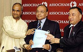 Assocham president Mahendra K. Sanghi (Centre) releases Assochams blueprint on Vat in New Delhi on Monday.