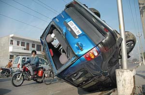 The Scorpio that overturned on a road separating Sector 71 and Phase 3B-2 in Mohali on Monday. 