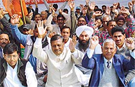 BJP activists stage a dharna in Sector 17, Chandigarh, on Monday.