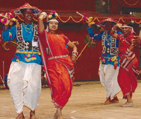 WELCOME TO SURAJKUND: A tribal group of Chattisgarh performing their dance during a function, organised by the Ministry of Tribal Affairs at Talkatora Stadium in the Capital. 