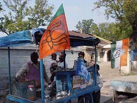 A tea vendor sports the flags of the BJP, the BSP and the Congress in Ambala
