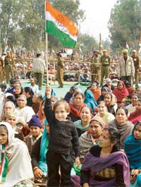 A child with a Congress flag cheers during an election rally addressed by the Prime Minister, Dr Manmohan Singh, at Ambala Cantonment on Monday
