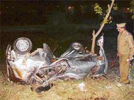 A policeman examines the car which was hit by the Shatabdi Express in Ambala