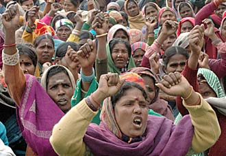 Members of the coordination committee of the government and Municipal Corporation of Chandigarh employees stage a dharna at Matka Chowk in Chandigarh on Tuesday.