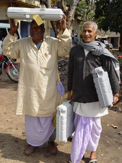 Poll officers carry electronic voting machines for their respective polling booths at Daltanganj under Palamu district on Tuesday for the first-phase poll in Jharkhand on February 3