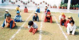 Children take part in fun games during the annual sports day of Small Wonders School