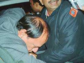 Income Tax officer Raj Kumar Arora being taken away by a team of CBI officials in Ludhiana