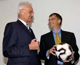 Microsoft chairman Bill Gates with a soccer ball