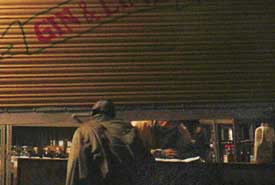 Liquor being sold from a partly-opened vend in the Industrial Area, Panchkula, on Wednesday. 