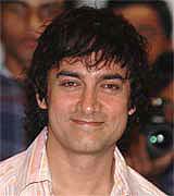 Bollywood star Aamir Khan sports his new look at the launch of Rakesh Mehra's film