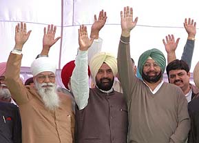 The Punjab Chief Minister, Capt Amarinder Singh, state Congress president H.S. Hanspal, and the Congress candidate from Ajnala, Mr Harpratap Singh, greet the crowd at a rally in Ajnala on Wednesday.
