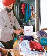 A man shows jewellery boxes from which his belongings were stolen in Sector 55, Chandigarh, on Thursday