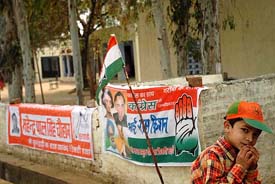Political parties defy the code of conduct by putting banners and flags on a polling booth at Haripur village in the Naraingarh constituency