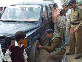 A police personnel deflates the tyre of a private vehicle in the Narwana constituency, on Thursday. 