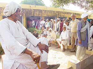 A long queue of voters at Rithos village polling station in the Sohna Assembly constituency on Thursday.