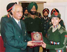 Maj-Gen Rakesh Dass, ADG NCC, honours city girl Inayat Dhanda at a function in Ludhiana