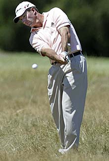 Australias Peter Lonard hits a shot on the 10th hole on the second day of the Heineken Classic at Royal Melbourne Golf Club in Melbourne on Friday. Lonard joined Briton Colin Montgomerie at the top of the leaderboard.