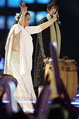 Asha Bhonsle reacts to fans cheering while performing among Asian and Western pop stars in the MTV Asia Aid  concert in Bangkok on Thursday.  The  concert is being held to benefit tsunami victims.