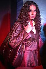 A model presents a leather jacket and leather bag as a part of the Indian leather company Hidesigns spring and summer 2005/2006 collections in Kolkata on Friday night.