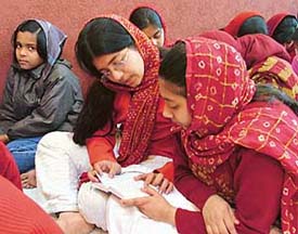 Students of Gupta Model High School attend a Sukhmani Sahib Path organised on the school premises on Saturday. 