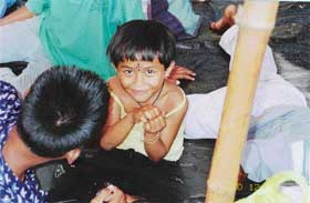 Smiling in the face of adversity  A Nicobarese child at a relief camp