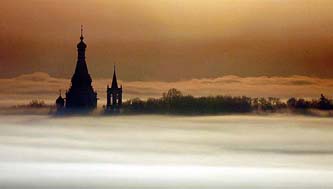 A monastery is seen through the early morning haze in the outskirts of Moscow on Saturday