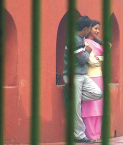 A young couple enjoying themselves, rain or shine, at Jantar Mantar