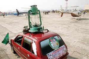 A big-size lantern, the RJD symbol, is erected on the roof of a car at Patna airport on Sunday. 