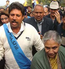 Delhi Chief Minister Sheila Dikshit and Kapil Dev participate in a walk, "Light for Life", in aid of the tsunami victims in New Delhi on Sunday.