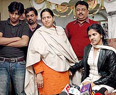 Twentyone-year-old Roma Jhawar (right), who was kidnapped on Friday from the Salt Lake area in Kolkata, with her relatives at her home in the city after her return early on Saturday.