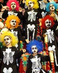 Children dressed in skeleton suits ride atop a float of the Imperador do Ipiranga samba school