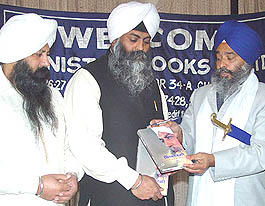 Jathedar of Takht Sri Kesgarh Sahib Tarlochan Singh releases a book "Singh-Yogi" at Chandigarh on Monday. Ranbir Singh and Kulbir Singh, sons of the late Harbhajan Singh Yogi, are also seen. 
