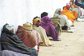 Beggars at Hanuman Mandir, Yamuna Bazaar, in the Capital